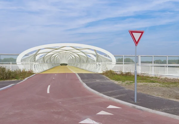 Modern bicycle and footbridge — Stock Photo, Image