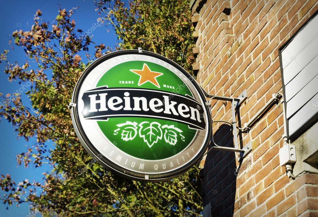 OLDENZAAL, NETHERLANDS - OCTOBER 19, 2014: Famous heineken logo at the facade of a bar on october 19, 2014. Heineken is one of the largest breweries in the world and employs over 80,000 people