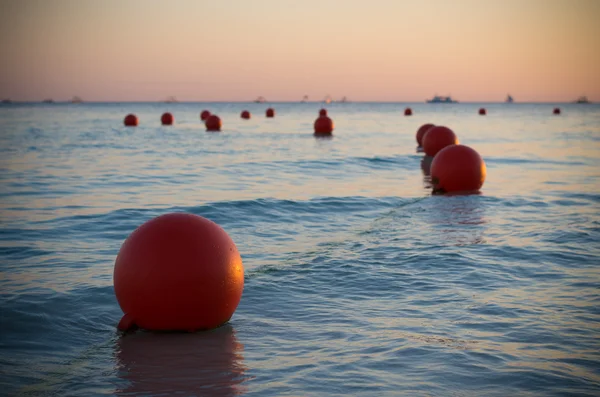 Buoys at sunset — Stock Photo, Image