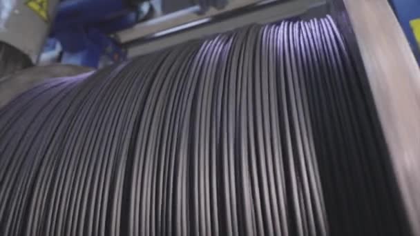 Cable factory. Winding of the electrical cable to the bobbin in the production. Cable pdroduction. Closeup — Stock Video