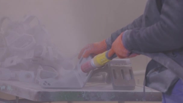 Sandblasting the part. Sandblasting metal parts in a factory. Sandblasting — Stock Video