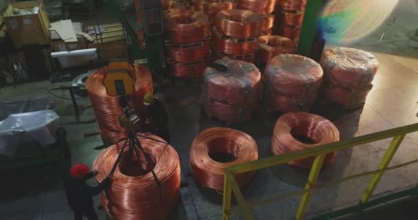 Men moving a bobbins with a copper cable, workflow at a cable factory — Stock Video