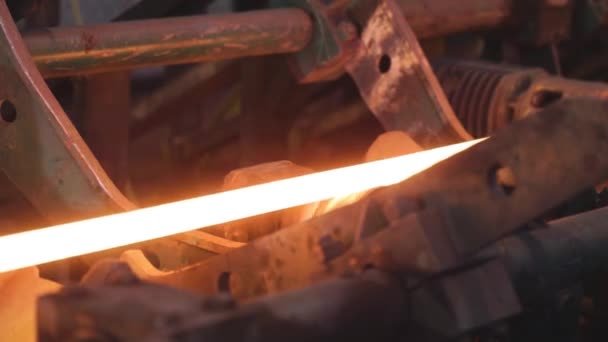 Rolling metal in production, moving on a hot metal ribbon, ball production phase, production process at a metal rolling plant, rolling through sparkling metal rollers — Stock Video