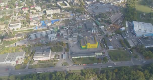 Flight over the industrial area. Many factories next to each other top view. Industrial area with modern factories top view. Plant top view. Yellow plant — Stock Video