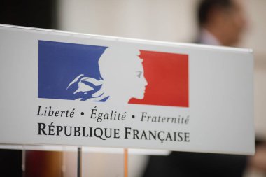 Motto of the French Republic on a cardboard sign 