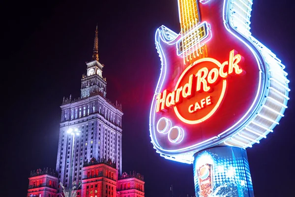 Warszawa, Poland, Nov 17, 2018: Neon light logo of Hard Rock Cafe and exterior near Palace of Culture and Science. — стокове фото