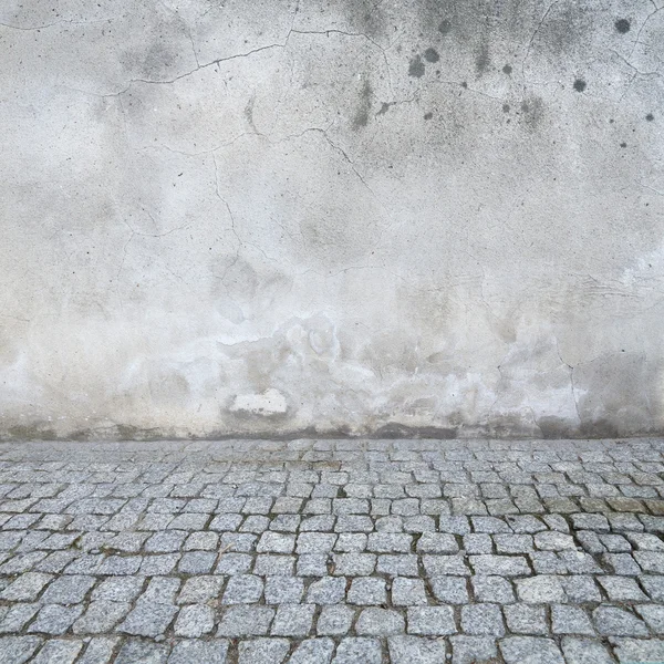 Grunge urban background, old wall texture bright plaster and blocks road sidewalk abandoned exterior urban background for your concept or project — Stock Photo, Image