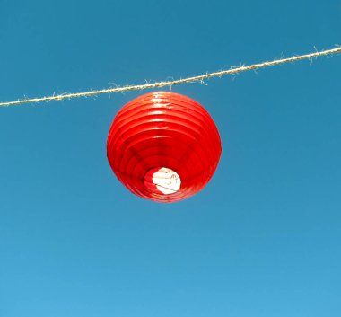 Chinese red lantern against blue sky clipart