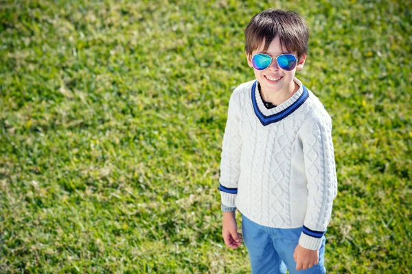 Cheerful little boy having relax outdoors — Stock Photo, Image