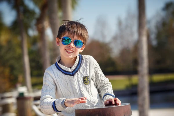 Cheerful little boy having relax outdoors — Stock Photo, Image