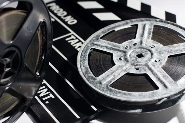 Old reel of film and cinema clap — Stock Photo, Image