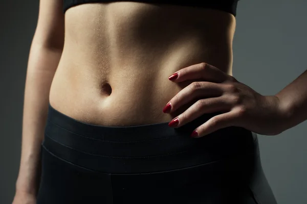 Close-up of athletic female belly — Stock Photo, Image