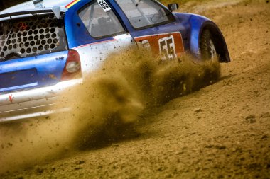 Autocross on a dusty road clipart