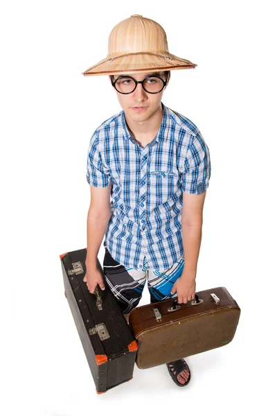 Joven en gafas con dos bolsas listas para viajar . — Foto de Stock