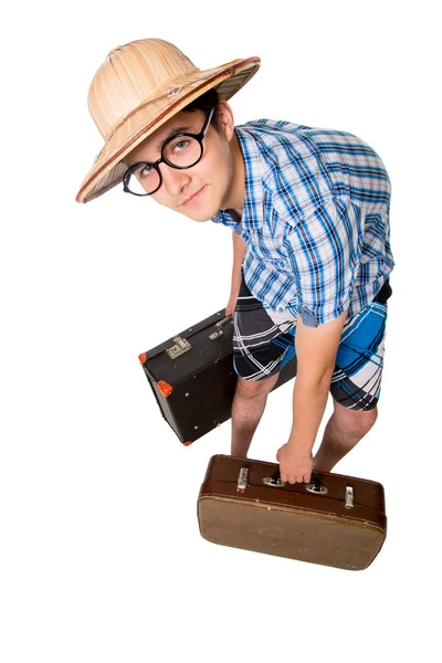 A young attractive man with glasses and two suitcases ready to t — Stock Photo, Image