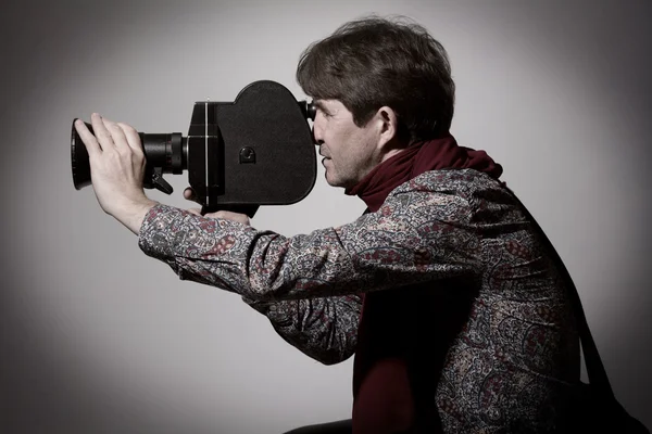 Portrait of a fashion cameraman with old movie camera — Stock Photo, Image