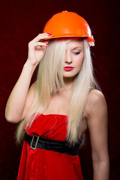 Portrait of a young girl in a helmet of the builder — Stock Photo, Image