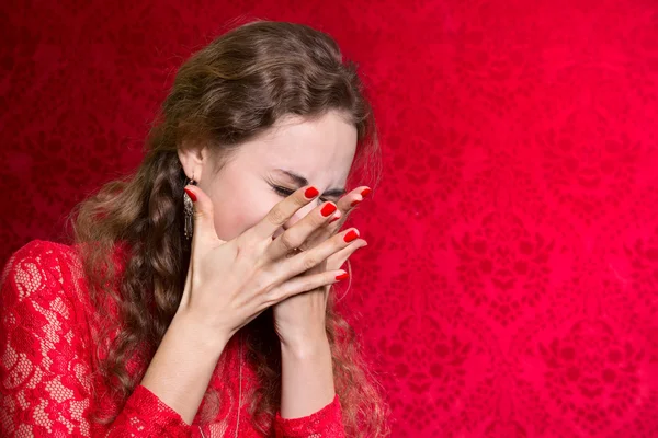 Portrait of a woman covers her face with her hands — Stock Photo, Image