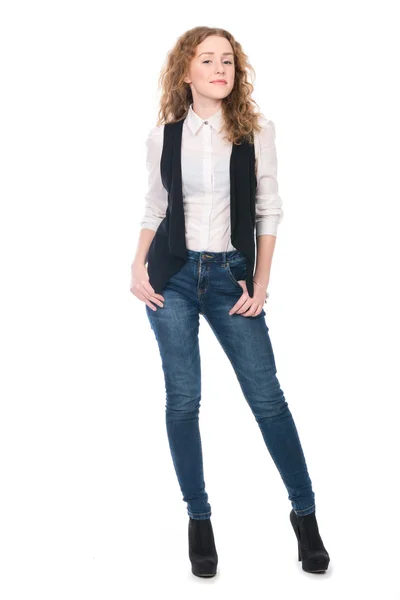 Portrait of young business girl with curly hair in jeans. — Stock Photo, Image