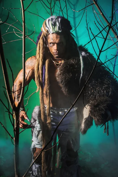 Muscular man werewolf goes through the woods — Stock Photo, Image