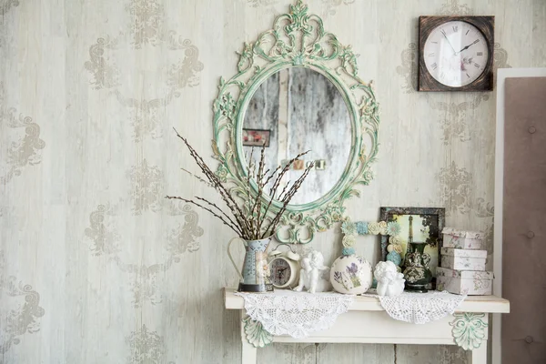 Vintage interior with mirror and a table with a vase and willows — Stock Photo, Image