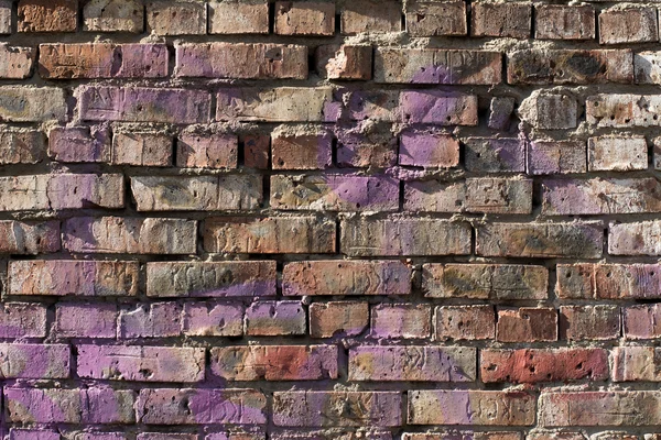 Old brick wall background with elements of paint — Stock Photo, Image