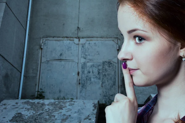 Psst - a beautiful girl with pigtails making a shushing gesture — Stock Photo, Image