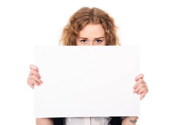 Young woman eyes over a blank promotional display isolated on a — Stock fotografie