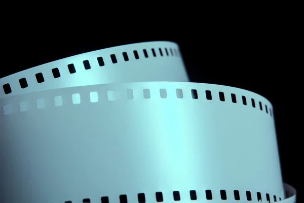 Strips of negative film strip on a dark background — Stock Photo, Image