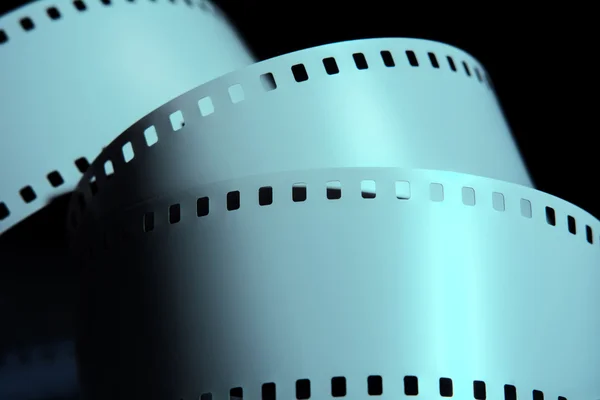 Strips of negative film strip on a dark background — Stock Photo, Image