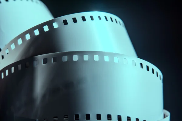 Negative reel of film on a dark background — Stock Photo, Image