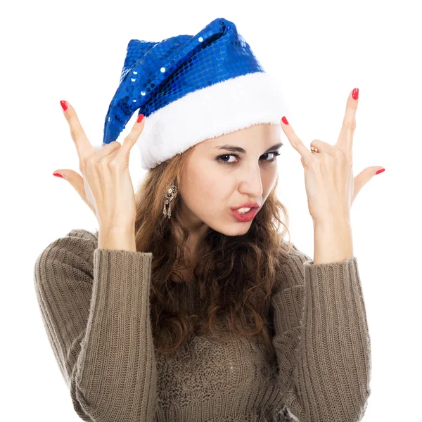 Chica en santa gorra cabras mostrando rock-n-roll signo — Foto de Stock