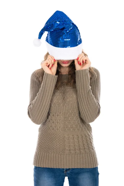 Angry woman with a christmas hat covering her eyes against a whi — Stock Photo, Image