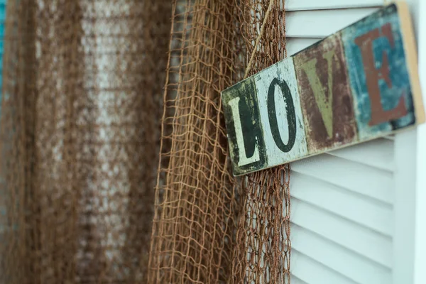 De plaat met de inscriptie geschilderd op de achtergrond van de liefde — Stockfoto