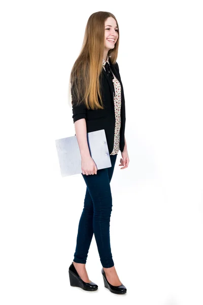 Full length of young blond smiling girl holding clipboard lookin — Stock Photo, Image