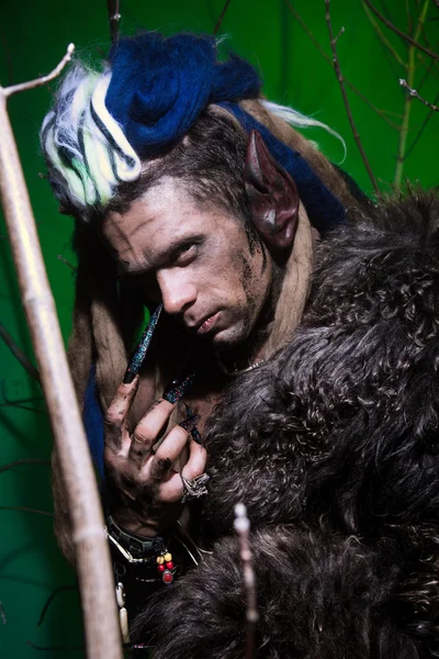 Portrait muscular werewolf with dreadlocks with long nails among — Zdjęcie stockowe