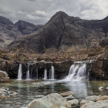 fairy pools waterfalls and sgurr an fheadain in glen brittle isle of skye scotland clipart