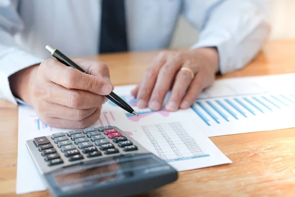 Businessman Analyzing Investment Charts Pressing Calculator Buttons Documents Accounting Concept Stock Photo