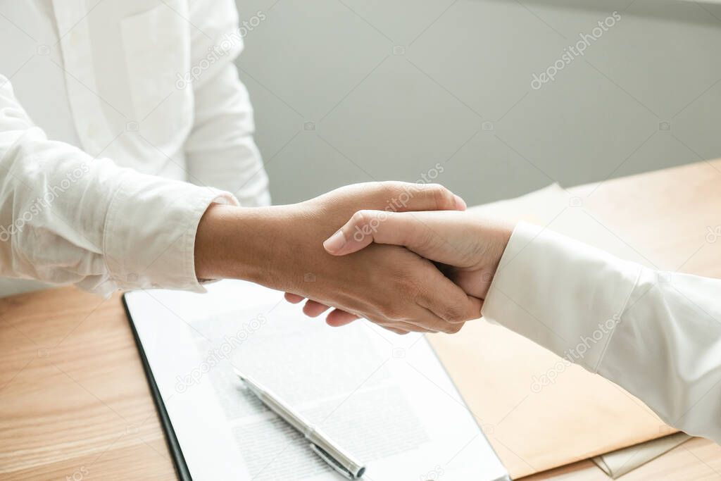 Lawyer handshake with client. Business partnership meeting successful concept