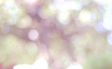 Bokeh pastel arka planının soyut hali. Bokeh ışığı. Çok renkli soyut arkaplanda parıldayan bulanık spot ışıkları