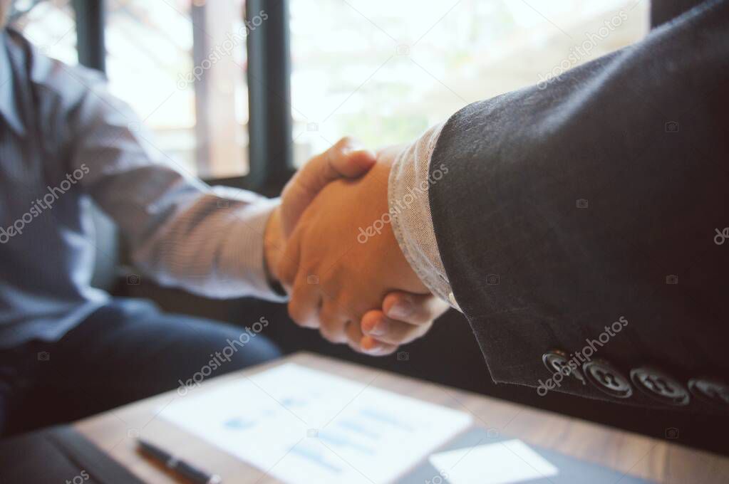 Image business mans handshake. Business partnership meeting concept.