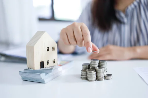 Saving money for Real estate investment with with stack of money coins for buying home and loan for prepare in the future financial insurance