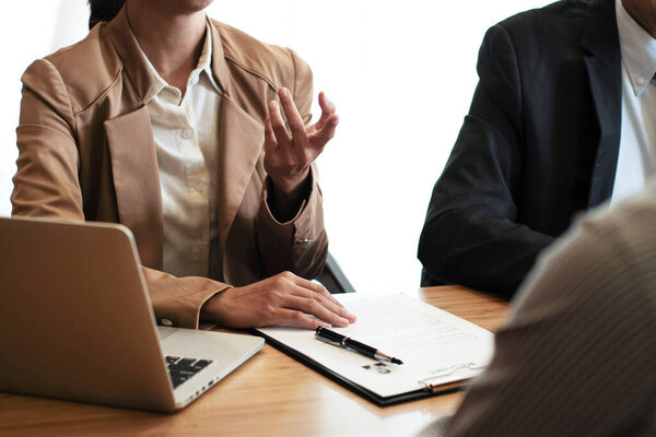 Examiner reading a resume during job interview at office Business and human resources concept.