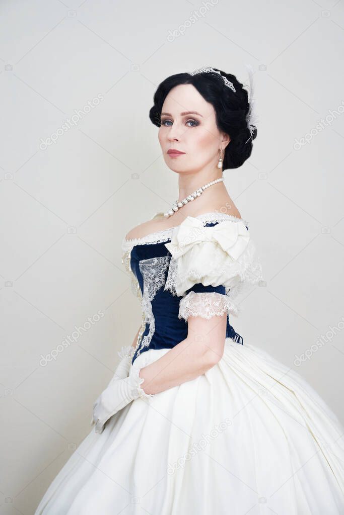 Beautiful elegant woman in a historical dress