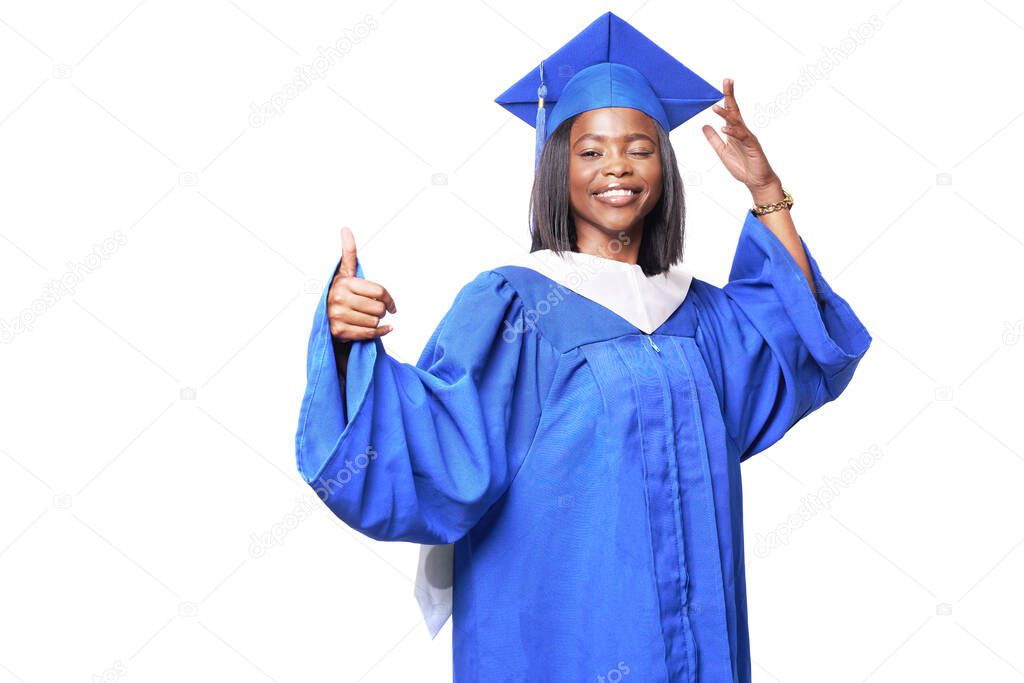 Black woman in a blue robe on a white background smiles,winks and shows thumb up