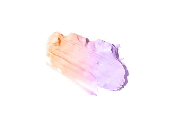 Smeten och konsistensen av krämen.Persika-lila färg, isolerad på en vit bakgrund. Ett element för kosmetisk skönhetsdesign. — Stockfoto
