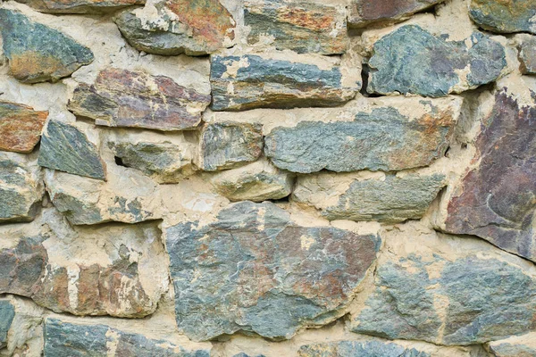 Una imagen detallada de un muro de piedra. Fondo de textura de pared de piedra vieja para diseño y decoración. —  Fotos de Stock