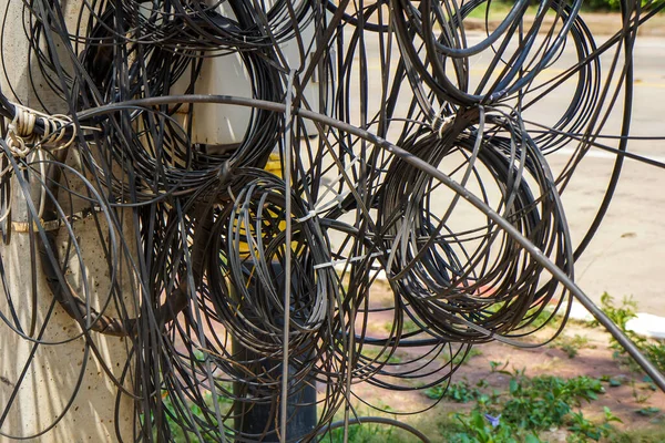 Telephone and internet cables get tangled up.