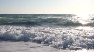 The noise of the sea and childrens laughter.