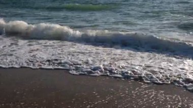 The noise of the sea and childrens laughter.